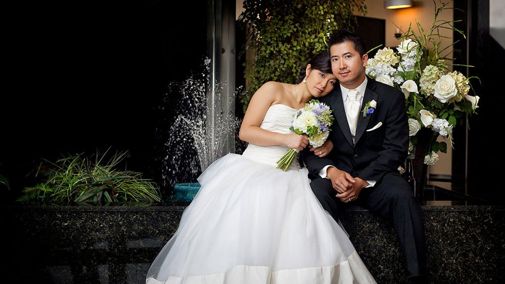 Sonia Dong and her husband Khiem pose for their portrait photos on their wedding day.