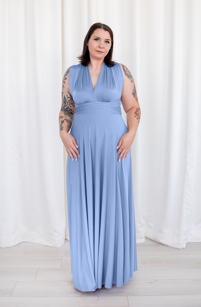A smiling woman wearing the Henkaa Sakura Maxi convertible formal floor-length dress in dusty blue.